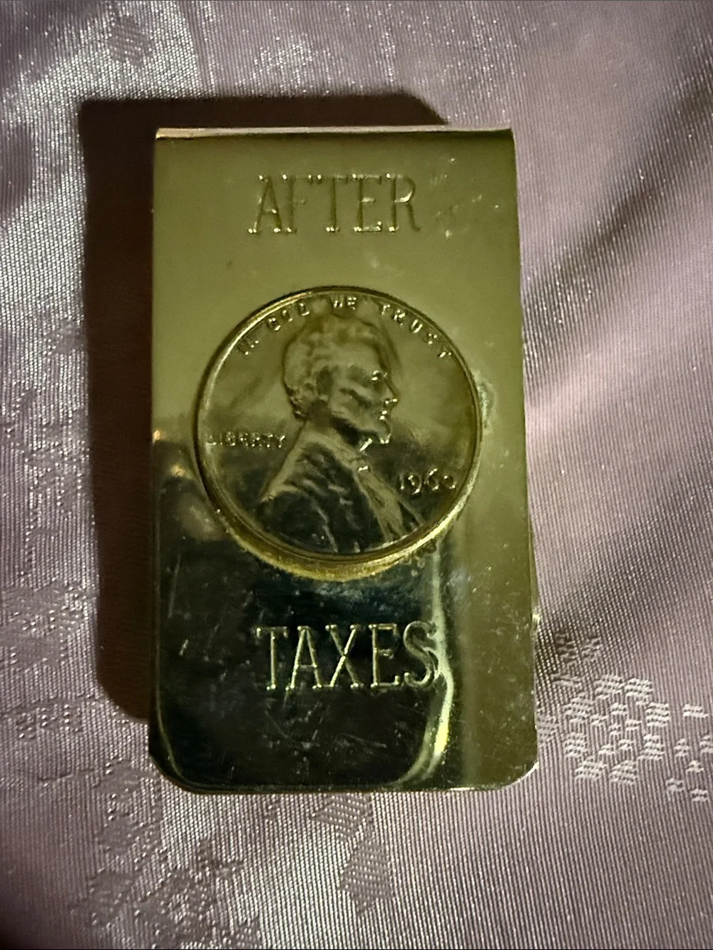After taxes, Penny, money clip and gold tone